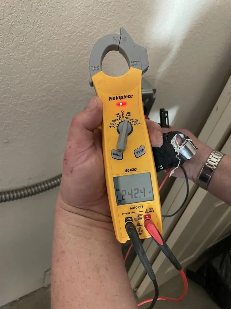 Voltage testing with clamp meter during Circuit Breaker Repair in Seekonk